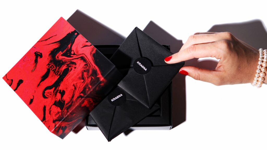 Heels Make Deals Krasna Chocolate Feminine Elegant Packaging Design in Red Black and Gold, Luxury Chocolate Branding